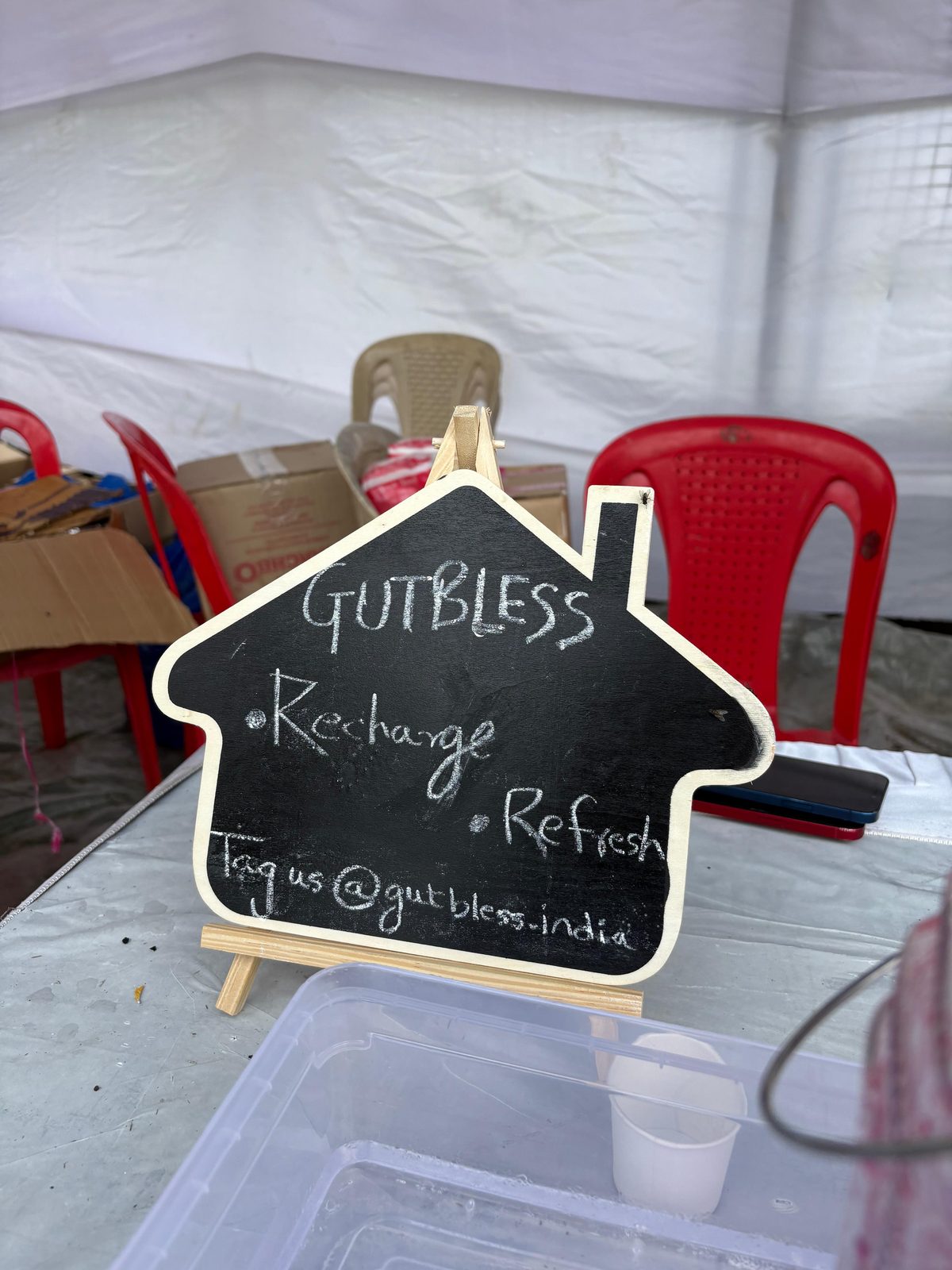 GutBless Recharge and Refresh chalkboard sign at an event stall